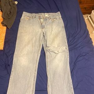Distressed cinch skater jeans